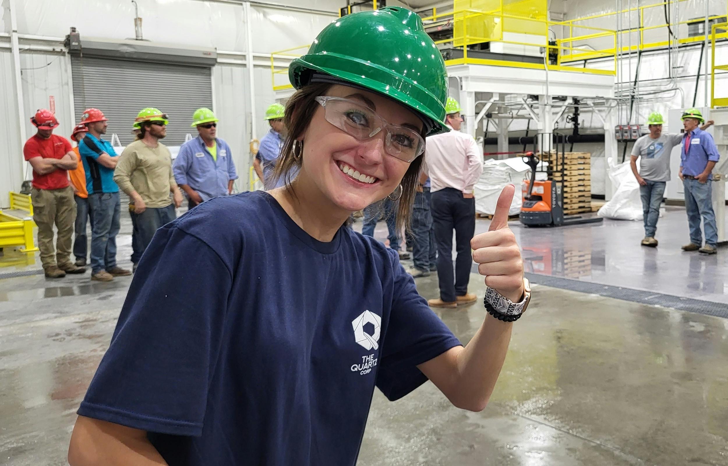 Female intern exploring jobs for chemistry majors at a production facility.
